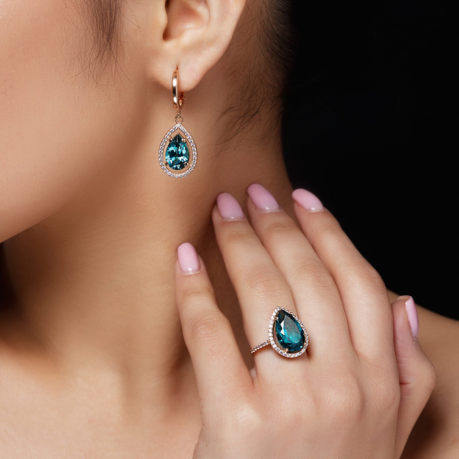 model-shows-earrings-ring-with-beautiful-blue-precious-stones (1) model-shows-earrings-ring-with-beautiful-blue-precious-stones (1)